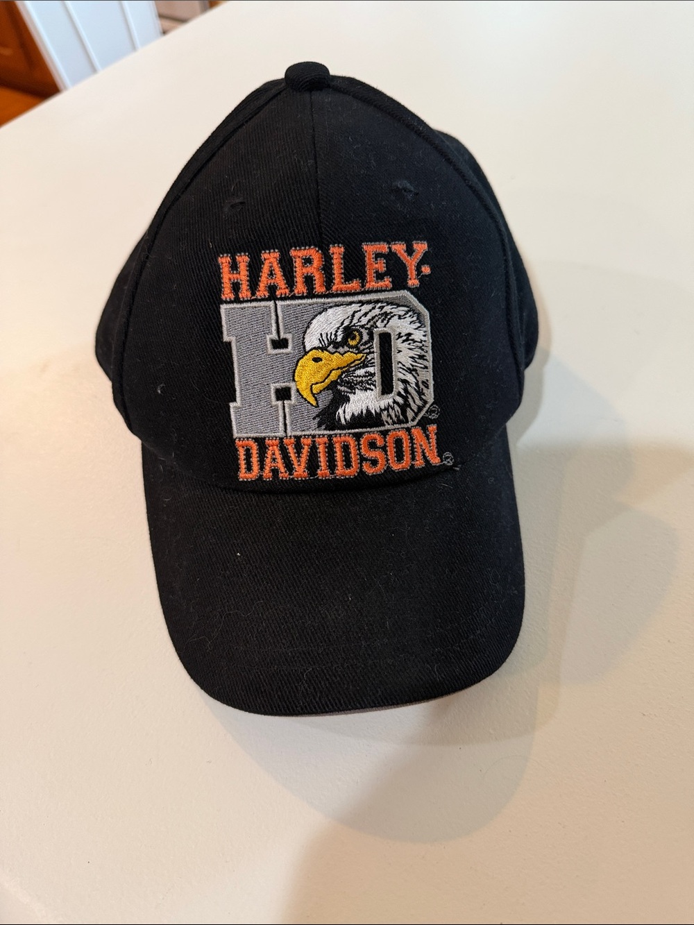 Harley-Davidson Black Mens Cap with Orange & Yellow Embroidered Logo.  OS